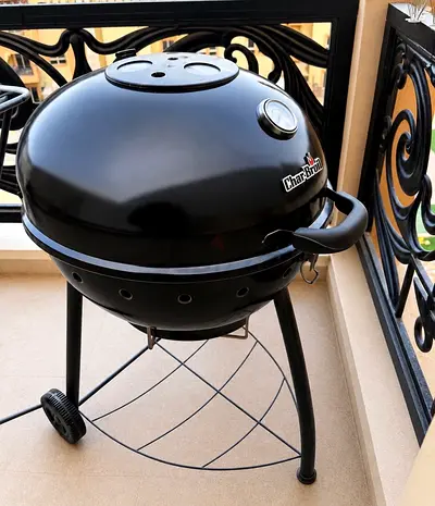 Brand new Char-Broil 57 cm (22-inch) charcoal BBQ grill with a built-in thermometer.
