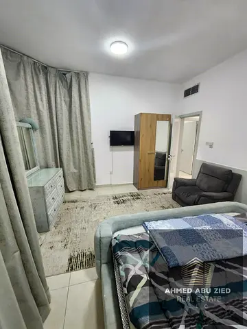 An exquisite two-bedroom apartment with a living area, located in the prime Al Khor Towers, Ajman.