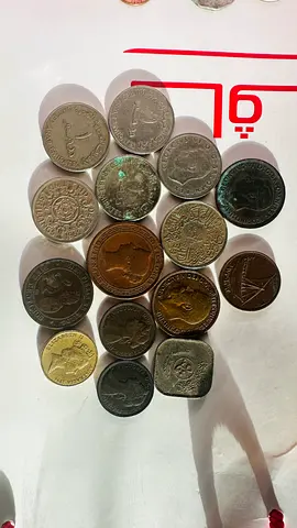 Collection of vintage collectible coins from different countries.