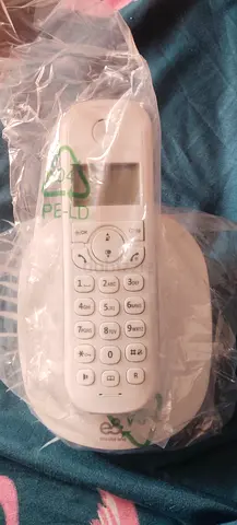Brand New white phone charger and wired headset - working condition