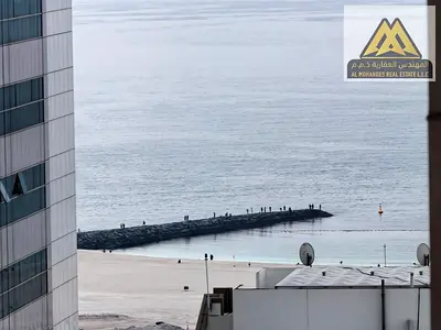For sale in Ajman One Towers, near all services and close to the Corniche: two bedrooms and a large