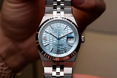 Rolex Oyster Perpetual Land‑Dweller style watch with blue textured dial