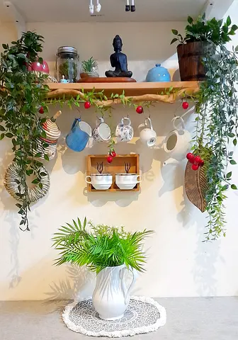 Jug vase with artificial plants