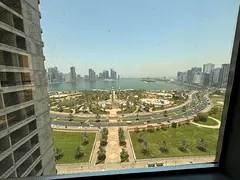 Two bedrooms and a spacious living room for annual rent in Al Majaz 2, with three bathrooms, built-i