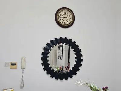Round Decorative Wall Mirror — Black Metal Frame, Good Condition