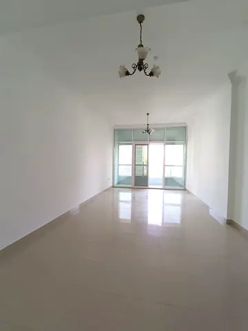 For annual rent in Al Taawun: 2BR apartment with balcony, 3 bathrooms, pool, gym, and kids’ area. A