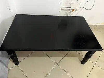 Black wooden coffee table, solid legs, good condition