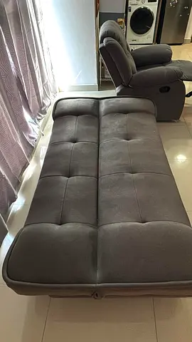 Grey fabric sofa bed - single seater recliner with fold-out bed