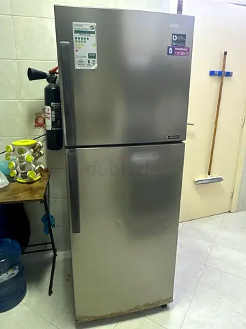 Silver double-door refrigerator - good working condition