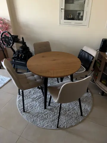 Round wooden dining table with 4 fabric chairs - perfect condition with carpet