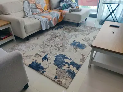 Modern abstract area rug in beige, blue and grey - good condition