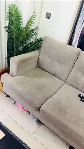 Light grey two-seater sofa in good condition