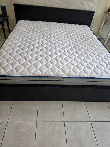 Kimg size wooden bed frame with mattress - good condition. Single King Size mattress. Both being so