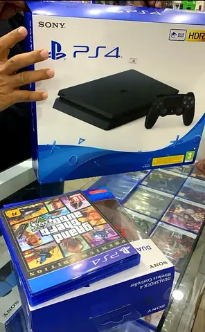 Sony PlayStation 4 Slim 500GB with Games, with 2 orginal controllers only 5 months used