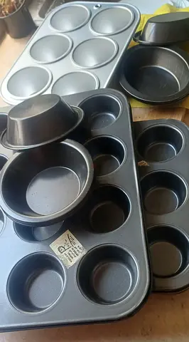 CUPCAKE MOULDS, FRYING PAN,. CRYSTAL BOWL.