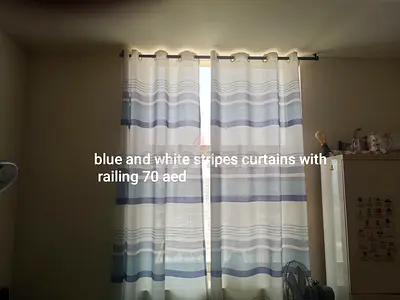 Big size long curtains with railing take all for 150 aed