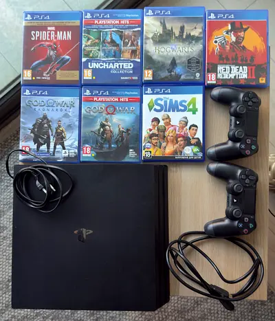 Sony PlayStation 4 Pro Console with 2 Controllers and 7 Games