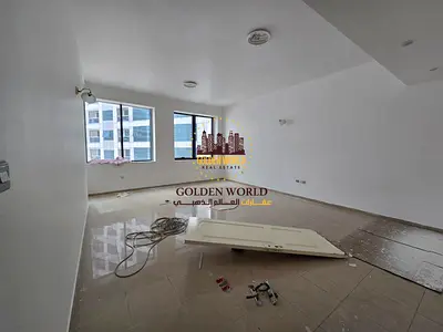 For Rent in Al Majaz 3: Fully renovated 2BR apartment with hall, free A/C, open kitchen, built-in wardrobes, 2 bathrooms, 1 month free, 4/6 cheques.