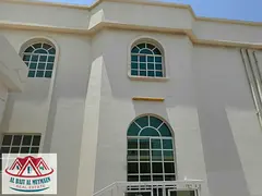Two-story villa with five master bedrooms and two kitchens in Al-Ramaqiyah