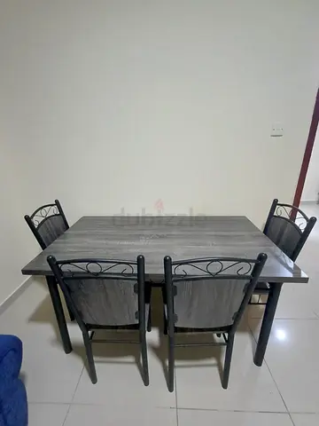 Elegant modern grey dining table with 4 chairs