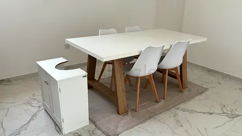 White dining table with 4 chairs, rug and cabinet