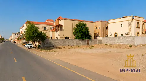 Residential and commercial land; corner plot with direct access to two streets, on Al-Talah Street in Al-Rawda 2, Ajman