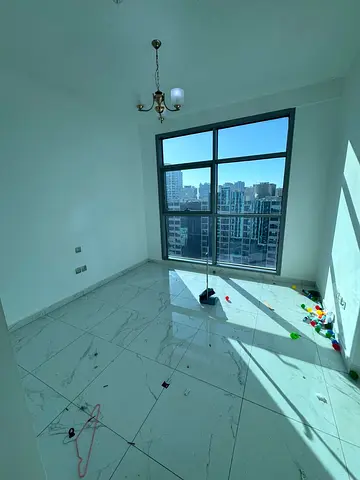 Two bedrooms and a spacious living room for annual rent in Al Majaz 1, with three bathrooms, built-