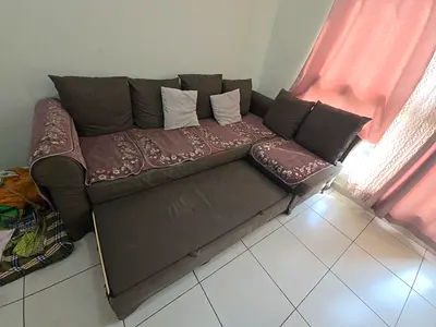 L-shaped fabric sofa with pull-out bed - IKEA