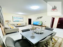 Sharjah Al Taawun, two-bedroom apartment with living room, kitchen, and two bathrooms