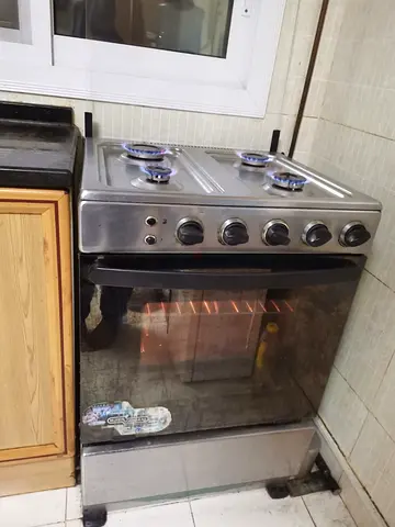 Super General stainless steel 4-burner gas stove with oven