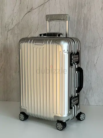 Rimowa aluminum carry-on suitcase with 4 wheels