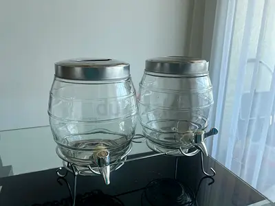 Pair of Glass Drink Dispensers with Stands and Lids