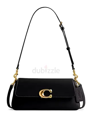 Coach Jet Shoulder Bag is crafted from black leather and features the brands signature gold-tone C