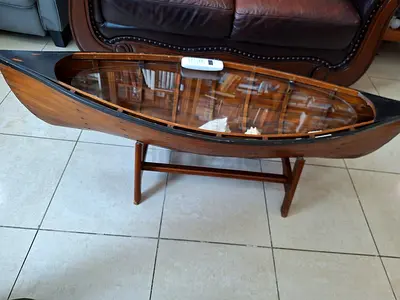 Vintage wooden canoe coffee table with glass top