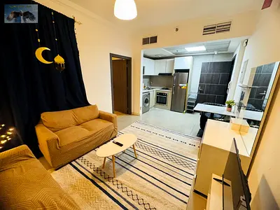 Furnished studio apartment for monthly rent with gym and pool access, including bills, in Al Rashidiya Clock Tower 1. Prime location near Safeer Mall