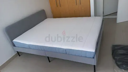 Queen size grey upholstered bed frame with mattress - good condition