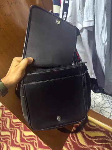 Black leather backpack with front flap - good condition