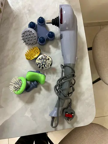 Handheld electric massager with multiple heads - light used