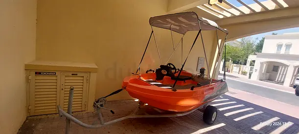 Orange Whaly Boat with Bimini Top and Trailer