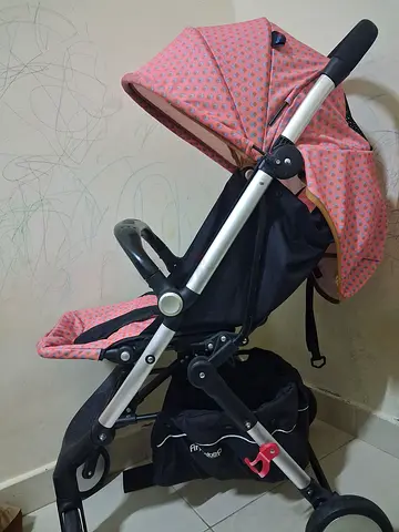 Lightweight pink baby stroller / pram - good used condition