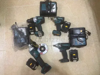Makita cordless power tool kit - drills, impact, angle grinder + chargers  batteries