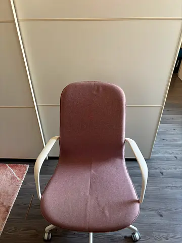 pink office chair with armrests and wheels