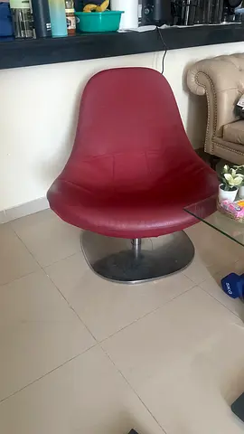 Red swivel lounge chair with chrome base - good condition