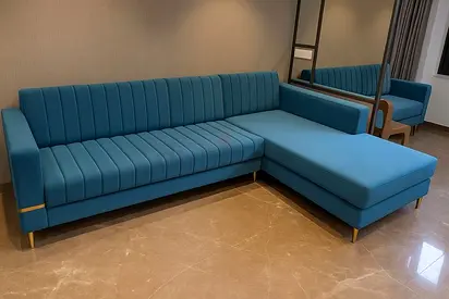 Modern teal L-shaped sofa with chaise