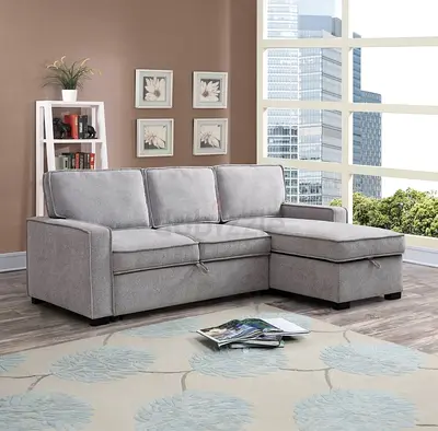 URGENT - Light grey 3-seater sofa bed with chaise - good condition. With table and carpet for free.