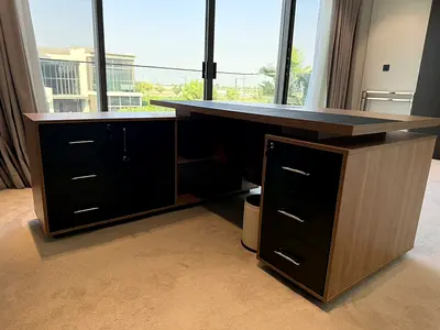L-shaped executive wooden office desk with drawers and storage