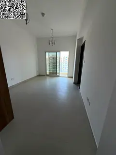 A spacious studio featuring a balcony, kitchen, bathroom, and built-in wardrobes