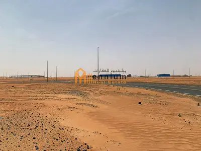 For sale in Rawdat Al-Qurt: a residential corner plot facing two 24-meter streets, ready for construction, at an excellent price.