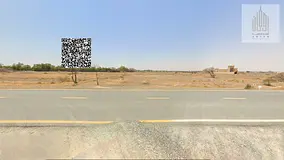 Residential land in Manama 8, behind the school