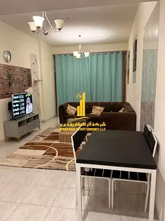 Luxury two-bedroom apartment with a living room and open balcony. Ajman, Al Rashidiya 3. Fully furni